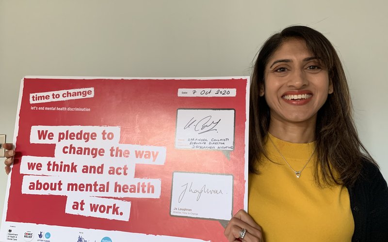 Harpinder Collacott holding DI Time to Change Pledge